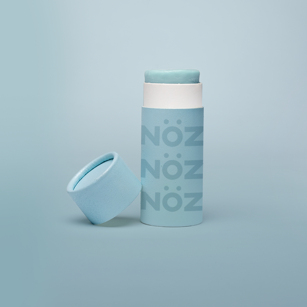 Sky blue Noz natural, vegan sunscreen in product packaging 